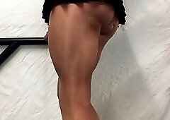 Tan thighs, cock in  black mini skirt .