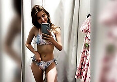 in the locker room in a swimsuit