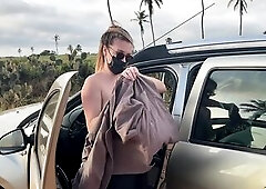 Sexy blond walks totally stripped next to a car on a public road. This babe shows her large natural melons and body whilst walking outdoors, risking b