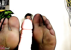 Blonde TS does a footjob with her feet in black pantyhose