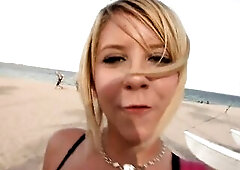 Golden-haired teen picked up on the beach gives a fine oral-sex to a large dick cumming on her face