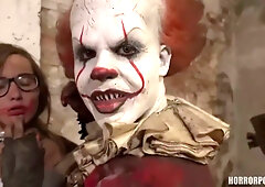 Young brunette faces down a clown in a derelict room
