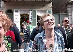 MILF flashes her large breasts during Mardi Gras street celebration
