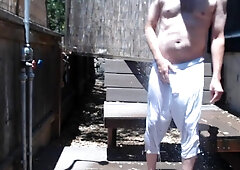 Neighbors observed me getting ultra-kinky in the outdoor douche! Ample stiffy in sheer cutoffs.