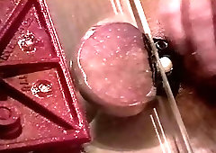 I crush my bottoms balls in a vise and jack his big cock