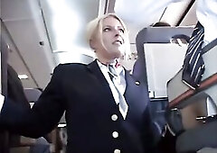 Blonde stewardess, Riley Evans is rubbing a client's dick on her first working day in the plane