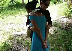 Laura brings her hot captive, Maria, to a secluded outdoor spot for a intimate handoff. This babe carries Maria, securely tied and gagged, throughout 