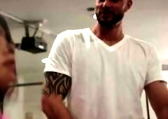 Bald guy cant stop starring at the ass of busty shemale while they are working out.After that,he goes to her and he then licks her ass to makes it wet