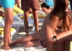 Young topless teens on the beach showing natural firm boobs in public!