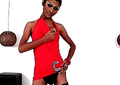 Feminine femboy in black fishnets whips out a monster cock