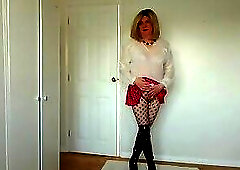 Short skirt, boots and fishnets
