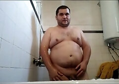 killer plump dude taking a shower