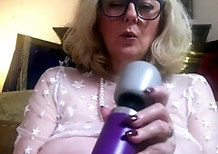 A super sexy blonde with big boobs and masturbating with a v
