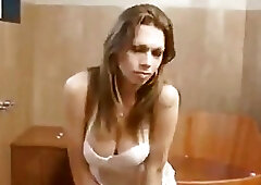 Lavish shemale with round tits strokes her big fat cock