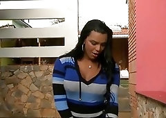 Busty brunette shemale plays with her giant cock and cums