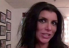 A black-haired milf with enormous bra-stuffers gives an
