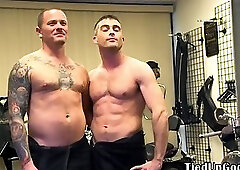 BDSM hunk spanks and whips sub in his office