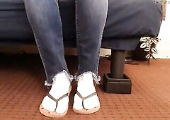 Wearing frayed jeans, on white ankle socks, in a couple of red watermelon print socks Sitting toe wiggling toe pointing and some standing dipping slid