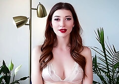 Brown-haired solo girl falls into trance while teasing her own cleavage on webcam