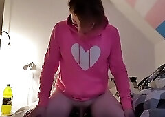 Cute shemale with glasses rides a sex machine to orgasm