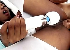 A black chick gets a cock in her ass and a vibrator over her cunt