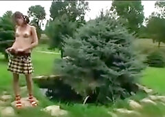 Little Caprice riding bicycle naked outdoors