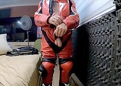 Fit guy in leather suit does a sexy striptease and masturbation with his giant cock