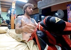 Fit guy in leather suit does a sexy striptease and masturbation with his giant cock