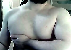 Muscular jock flexes on cam