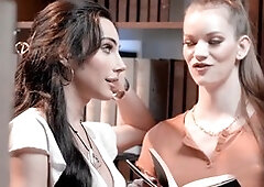 Hot brunette tranny Ariel Demure gives her cis girlfriend Erin Everheart a mouthful in the library