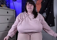 Nymph Melonie Kares plays with her huge natural tits in a baggy shirt and shows off her bra