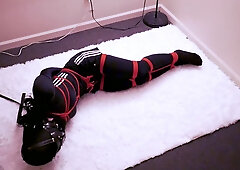 Crossdresser in exercise catsuit fights