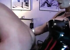 Carmen Rivera pegging and fisting a man in the butt