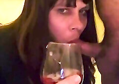 drinks sperm with glass