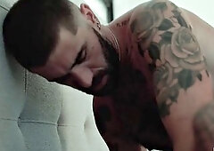 Tattooed man with hairy body banging a submissive fella