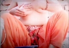 Beautiful Asian village girl Fabisocoo enjoys a bath, caressing her sexy curves and rubbing her ample breasts