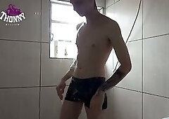 Well-endowed young man caught on hidden camera shaving in the shower