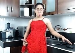 Nerdy Asian tranny in a sexy red dress flashes her nice cock