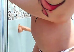 Horny blonde is riding her favorite dildo in the shower and moaning during an intense orgasm