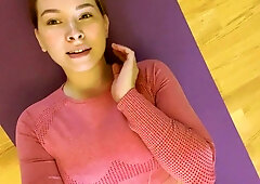Young teen stretches into intimate yoga poses on her purple mat