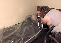 Bound and packed in leather sheeting and a straitjacket by Strapskinks