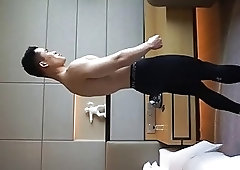 Chinese stud watches some porn then showers up