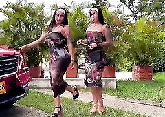 two LADIES WALK AND MOVING THEIR ASS CHEEKS IN A PARK