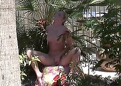 Amateur blonde rubbing her pussy in the backyard