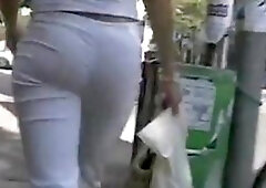 Tight bodied brunette's lush ass caught on a candid cam