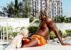 Sexy blonde tries black cock at the pool during her naughty holiday