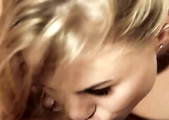 Cute Sybil pulls blond Nancy towards her and kisses her on the lips.