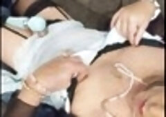 Sissy crossdresser in high heels gives a sensual handjob to the rhythm of music