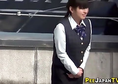 Chinese office dame in uniform took off her underpants in a public place to urinate on the sidewalk