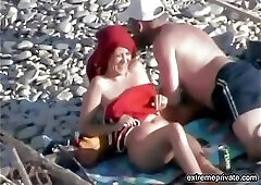 Spooning position on the beach (aunt and lover)